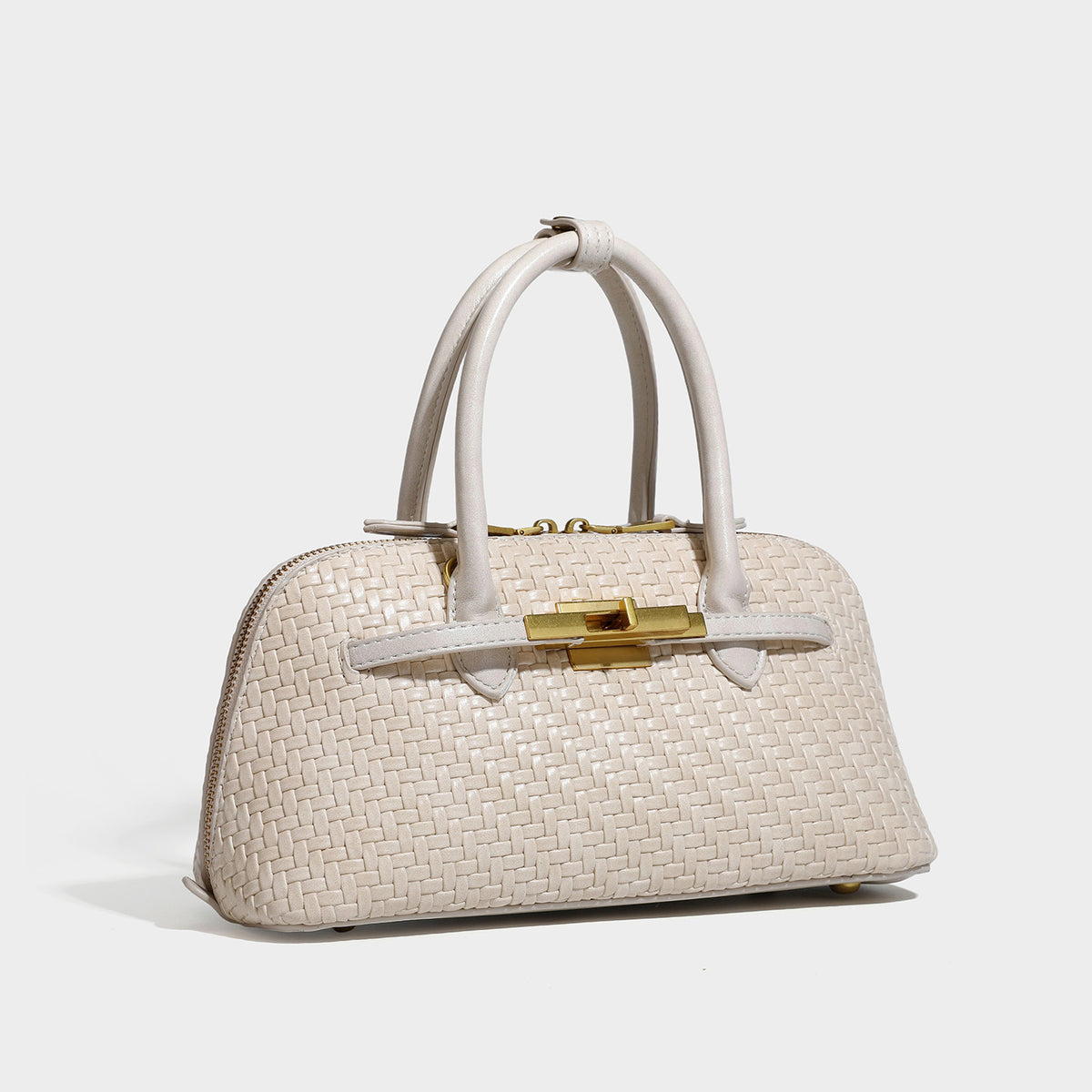 Structured woven-embossed leather-look satchel with dual rolled top handles, gold-tone turn-lock closure, and detachable