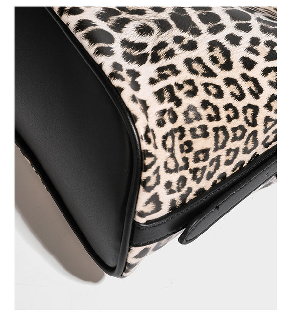 Slouchy leopard print shoulder hobo bag with black leather-look trim, tie-top closure, and single long strap, detail view 20
