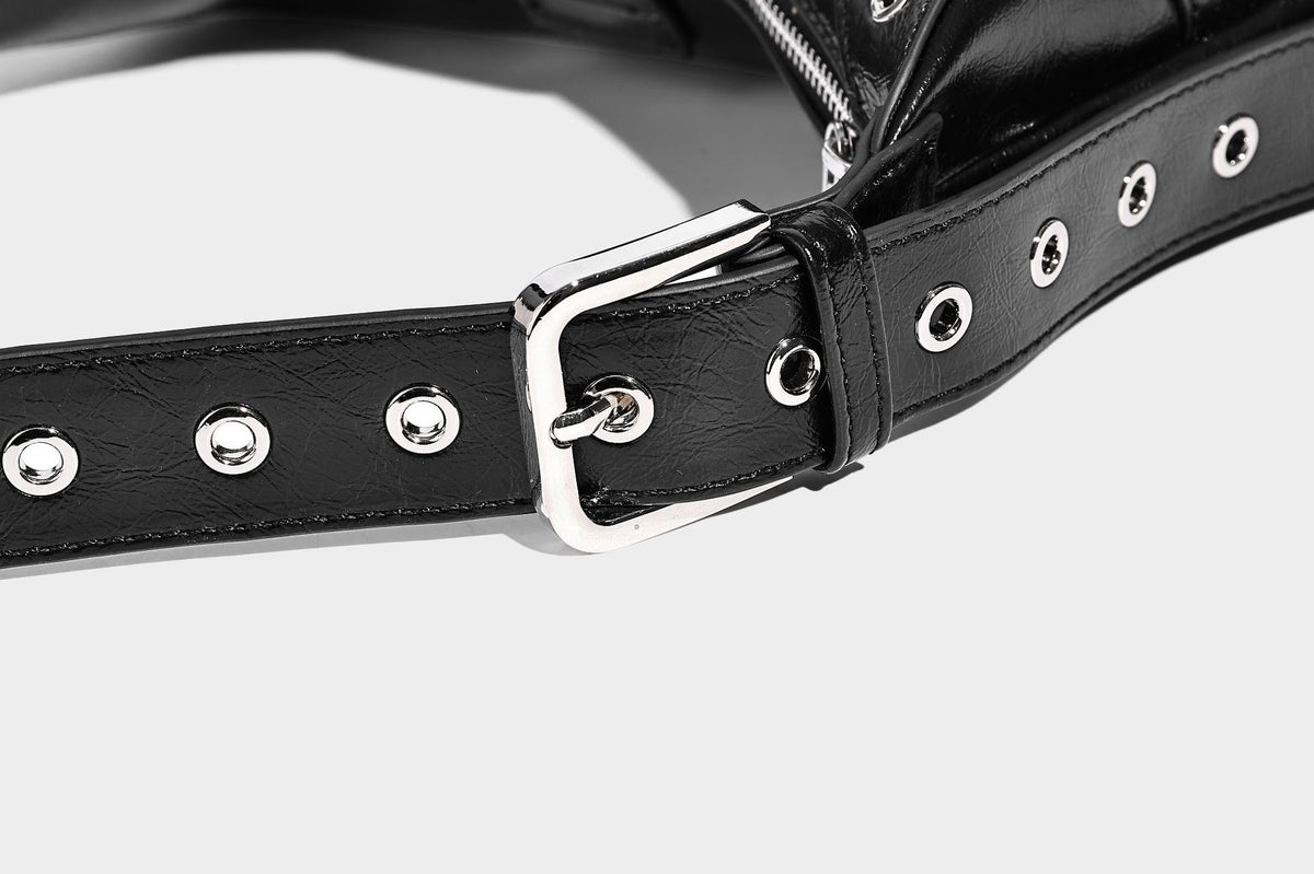 Glossy crescent hobo bag with silver-tone grommets, square buckle straps, and top zipper closure, detail view 21