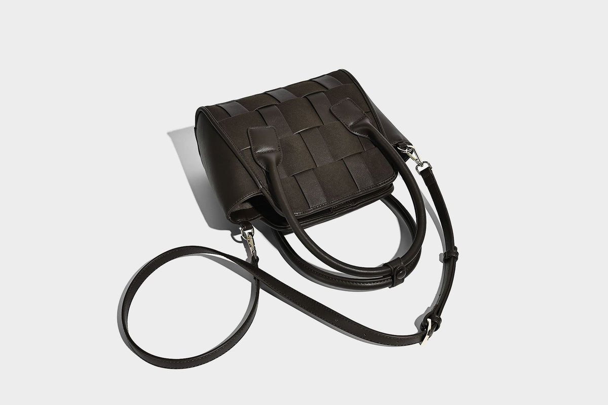 Small structured woven-panel mini tote bag with double top handles and detachable crossbody strap in matte leather-look