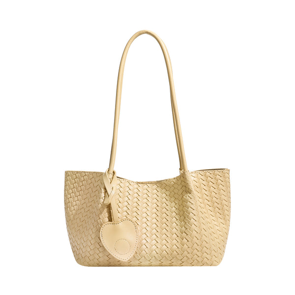 Woven leather-look tote bag in yellow with long shoulder straps, heart-shaped hanging charm, and removable inner zip pouch