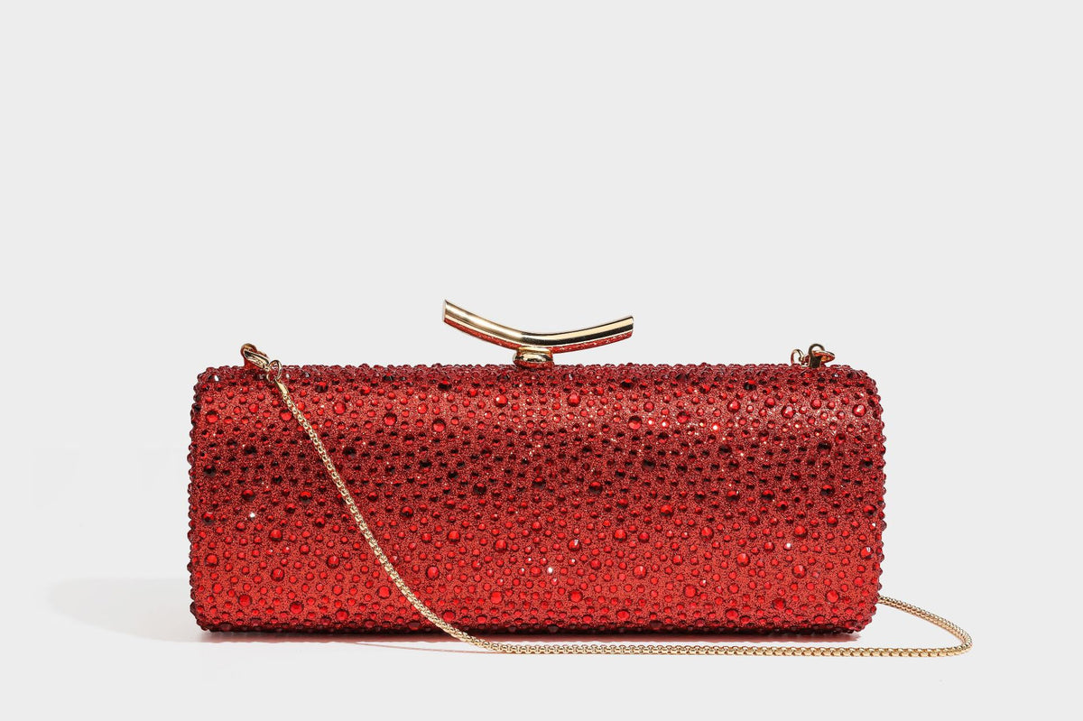 Structured rectangular hard-case clutch bag covered in all-over rhinestone crystal embellishment with curved kiss-lock top