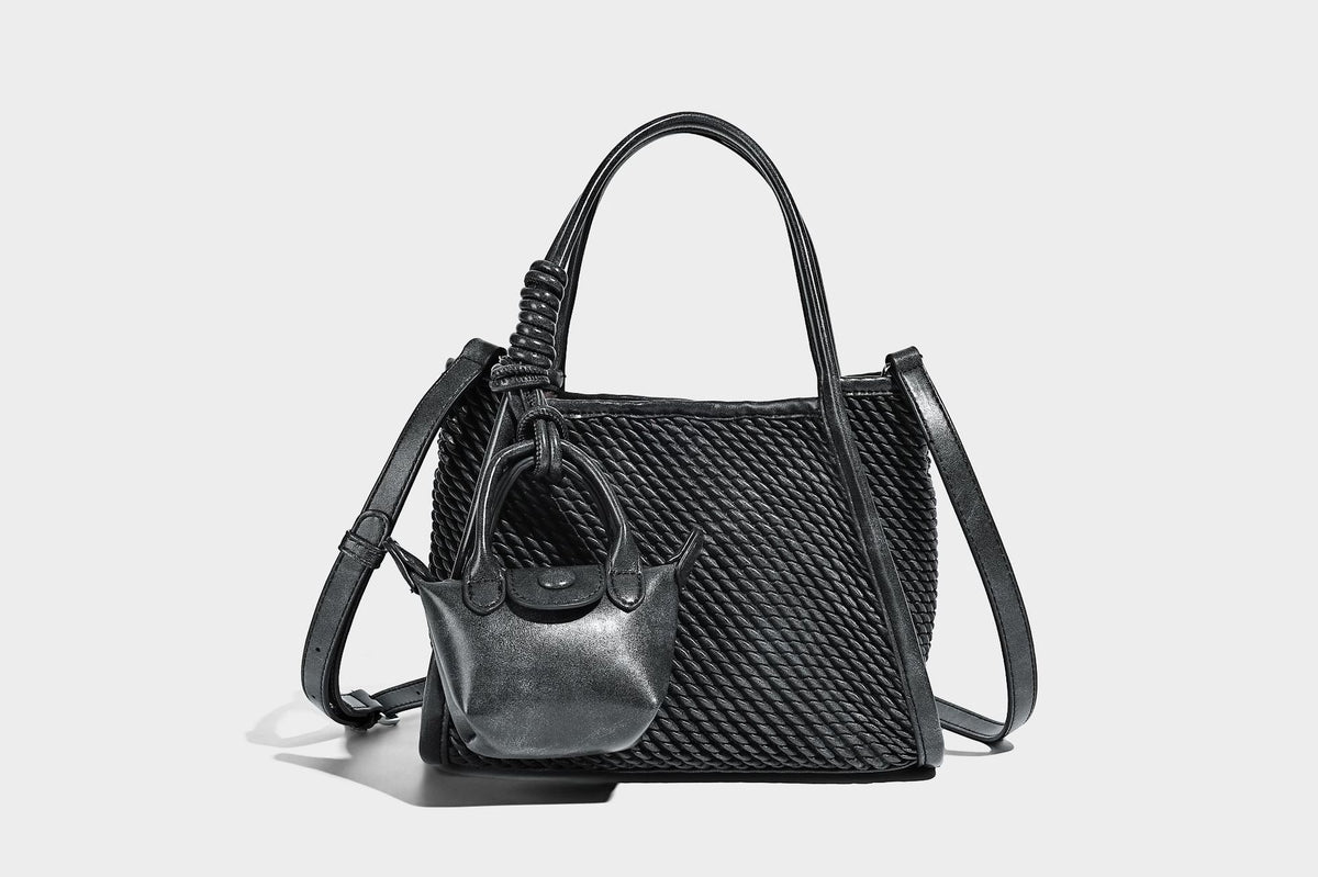 Large structured woven rope-texture tote bag with smooth leather-look trim, knotted dual top handles, detachable mini front