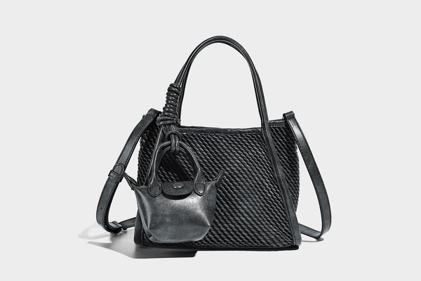 Large structured woven rope-texture tote bag with smooth leather-look trim, knotted dual top handles, detachable mini front
