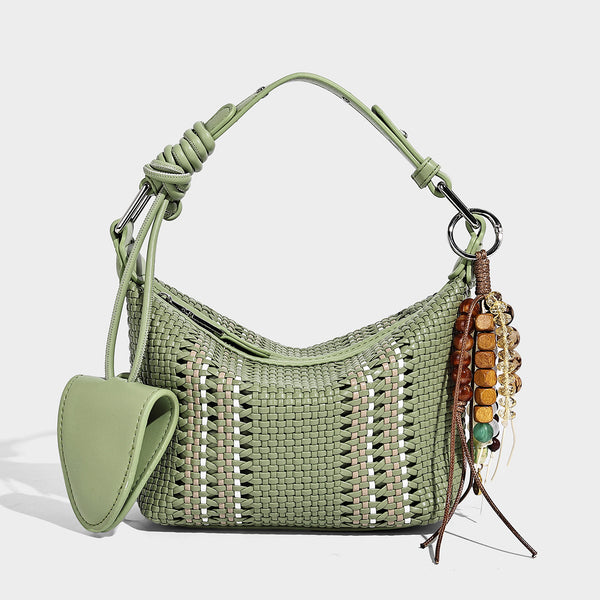 Small woven crescent shoulder bag with leather-look trim, zip closure, silver-tone ring hardware, and beaded tassel charm