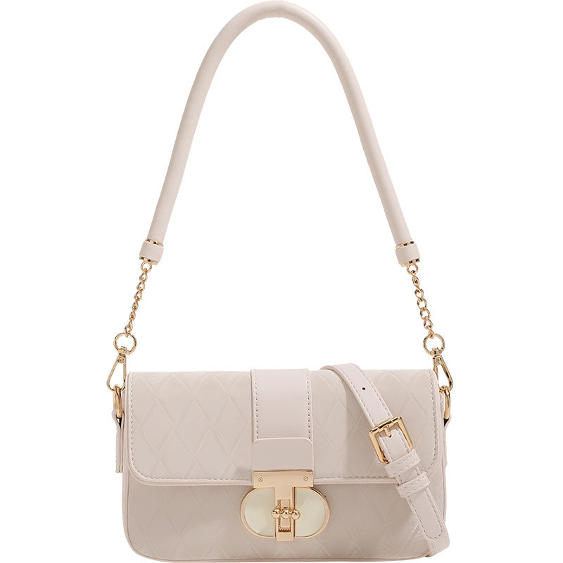 Compact quilted flap crossbody bag with gold turn-lock clasp and adjustable shoulder strap, detail view 5