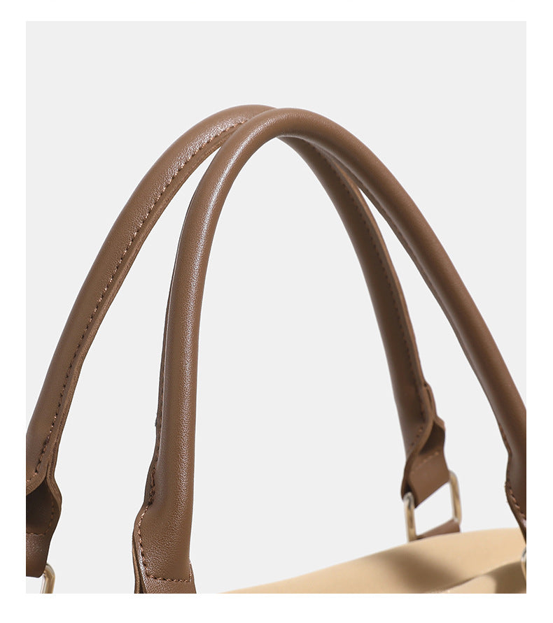 Large slouchy nylon tote bag with brown leather-look handles, double-pull zip closure, and star charm detail, detail view 15