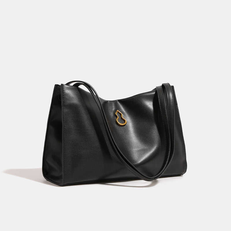 Smooth leather-look slouchy trapezoid shoulder tote with gold-tone gourd clasp hardware and long slim straps, detail view 2