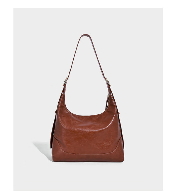 Glossy leather-look slouchy hobo shoulder bag with zip closure, gold-tone hardware, and adjustable strap, detail view 9