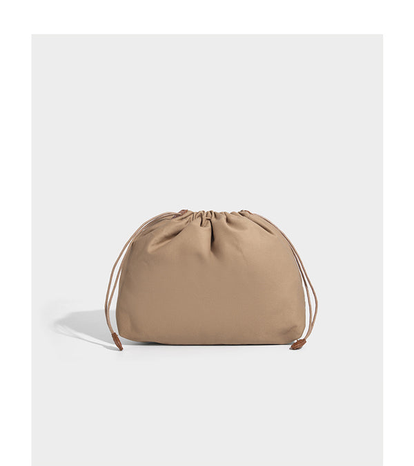 Structured woven herringbone tote bag with braided double shoulder handles in tan brown, shown with matching drawstring