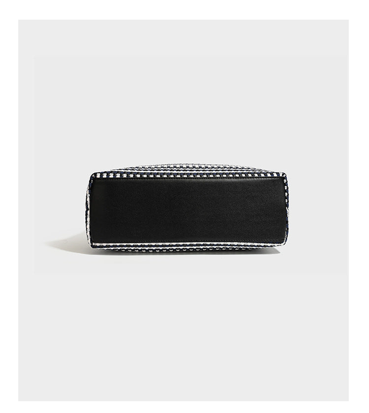 Slouchy woven stripe hobo shoulder bag with black-and-white pattern and leather-look strap, detail view 12