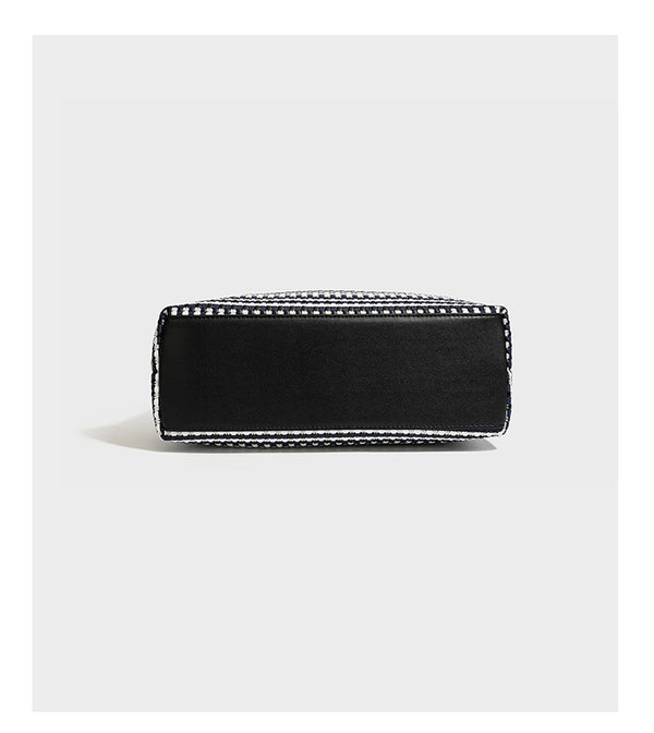 Slouchy woven stripe hobo shoulder bag with black-and-white pattern and leather-look strap, detail view 12