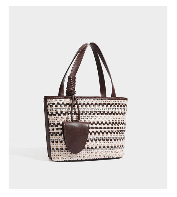 Kleine, strukturierte Tote-Bag aus gewebtem Karomuster mit glattem Besatz in Lederoptik, zwei Tragegriffen, abnehmbarem Schulterriemen und