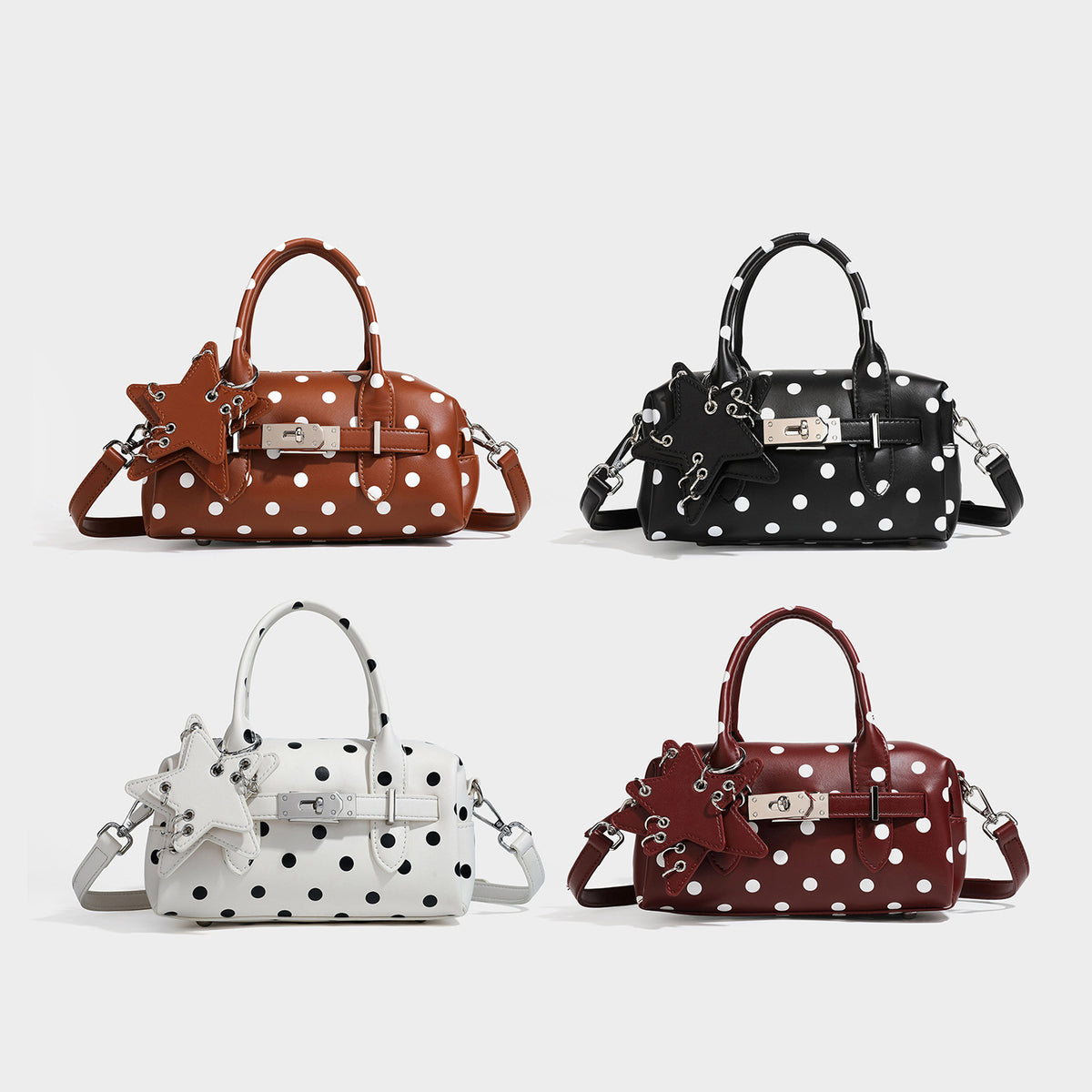 Small structured polka-dot mini satchel bag with star charm, buckle-strap front detail, dual top handles, and detachable