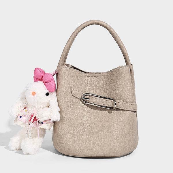 Mini pebbled leather-look bucket bag with front buckle strap, silver-tone hardware, top handle, and detachable shoulder