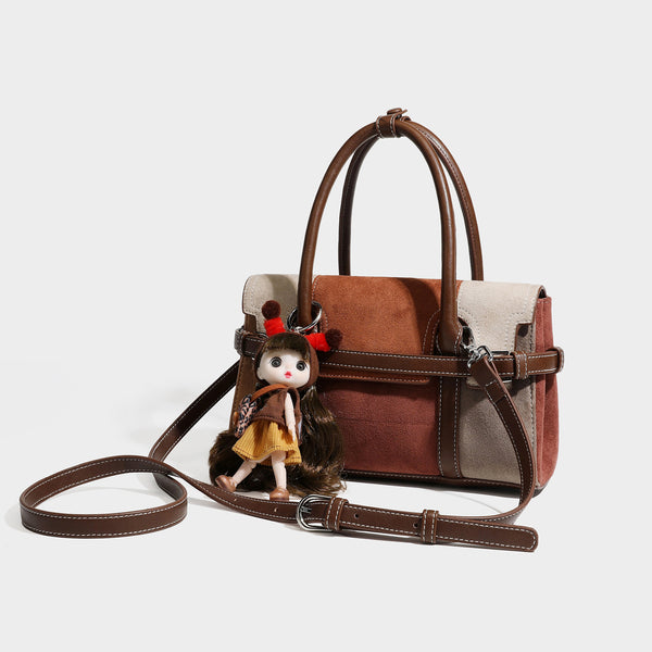 Structured color-block satchel bag in brown, rust, beige, and taupe suede-look panels with white topstitching, front buckle