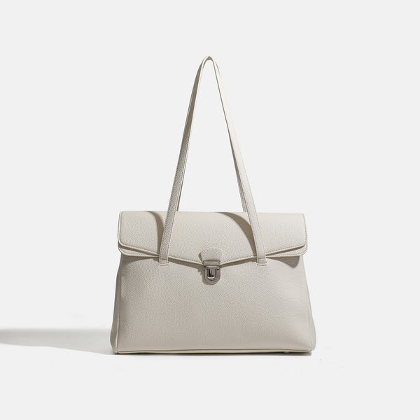 Structured black pebbled-finish flap tote bag with silver turn-lock clasp and long double shoulder straps, detail view 7