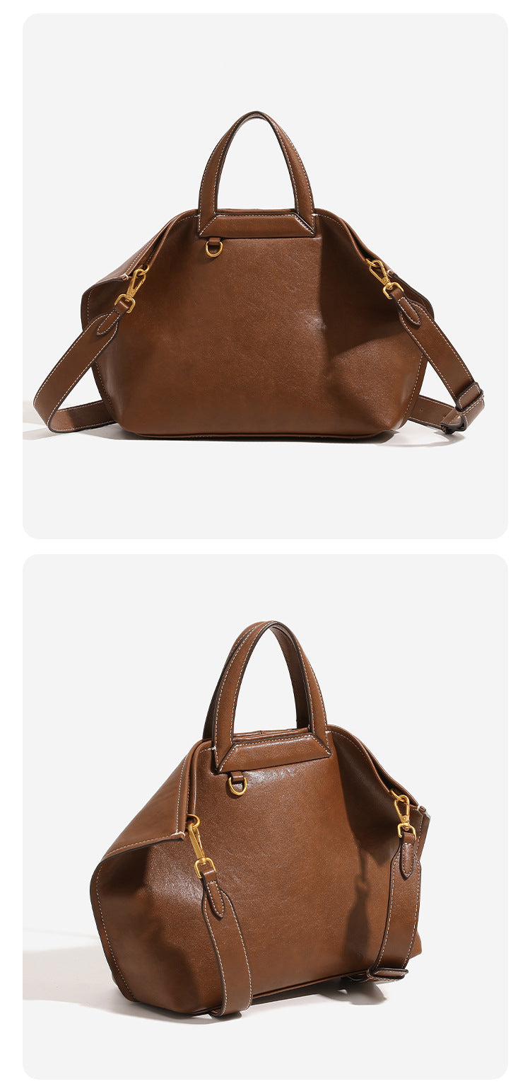 Structured cognac brown leather-look tote bag with fold-ear side panels, top handles, gold-tone hardware, and detachable