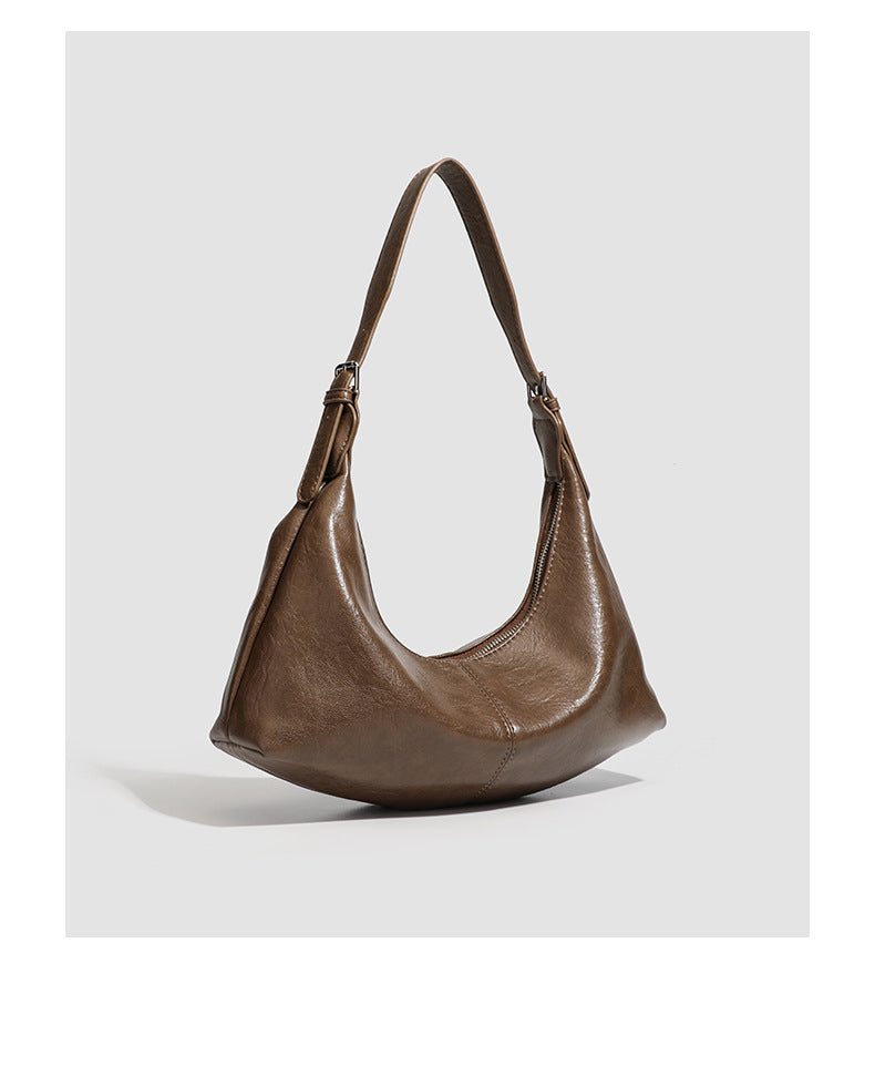 Slouchy crescent hobo shoulder bag with zip-top closure and adjustable strap, detail view 18