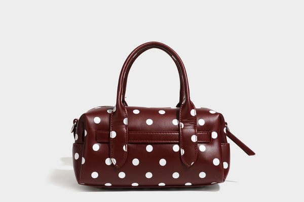Kleine, strukturierte Mini-Henkeltasche mit Punktmuster, Sternanhänger, Schnallendetail auf der Vorderseite, zwei Henkeln und abnehmbarem