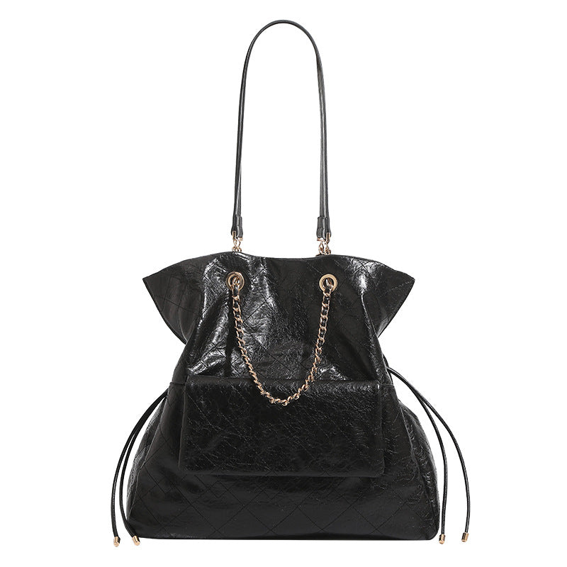 Quilted crinkled leather-look convertible tote backpack with gold-tone chain handles and drawstring closure, detail view 5