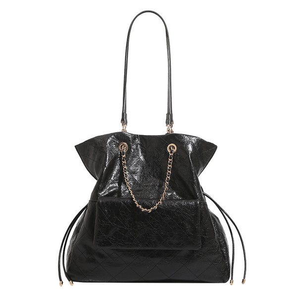 Quilted crinkled leather-look convertible tote backpack with gold-tone chain handles and drawstring closure, detail view 5