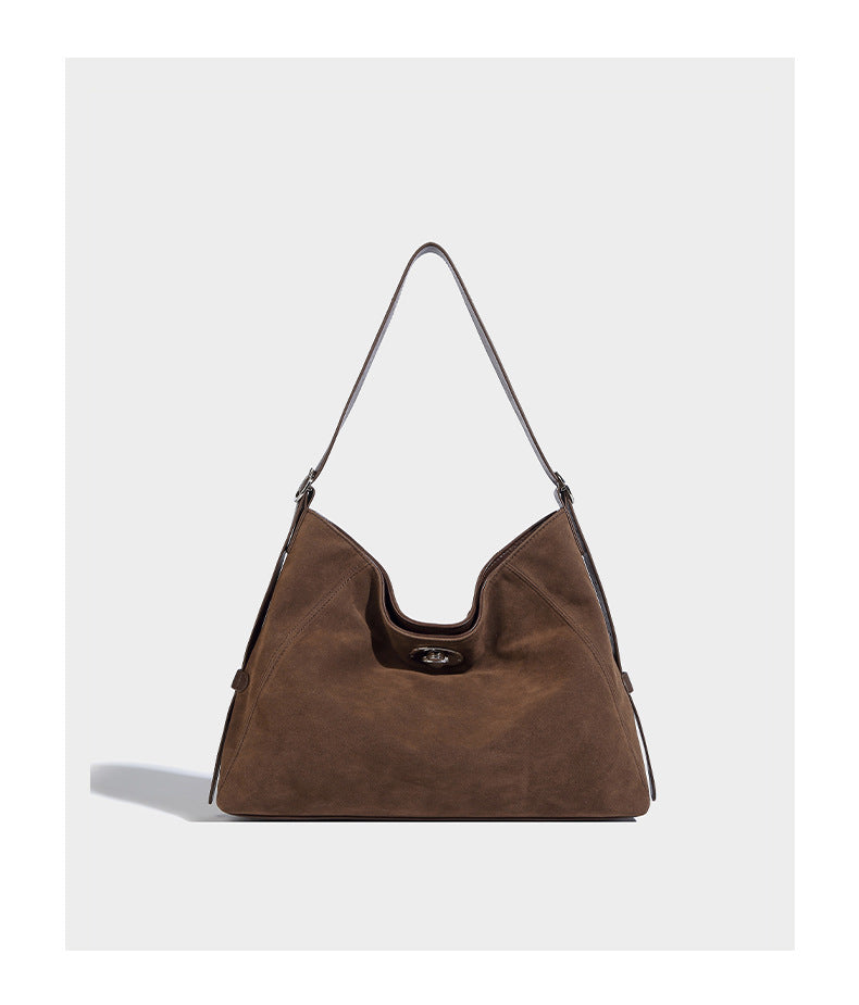 Slouchy hobo shoulder bag with turn-lock flap closure and adjustable strap, detail view 11