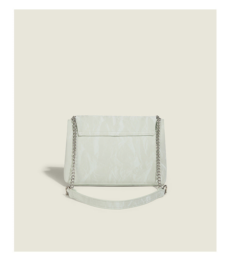 Structured rectangular chain shoulder bag with silver butterfly clasp and glossy crinkled finish, detail view 13
