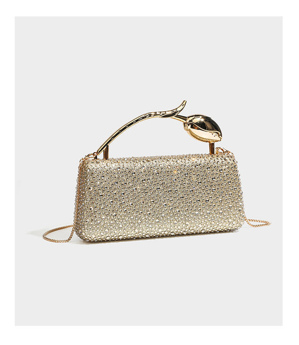 rectangular hard-case rhinestone evening clutch with sculptural gold-tone branch-and-bud top handle and detachable chain