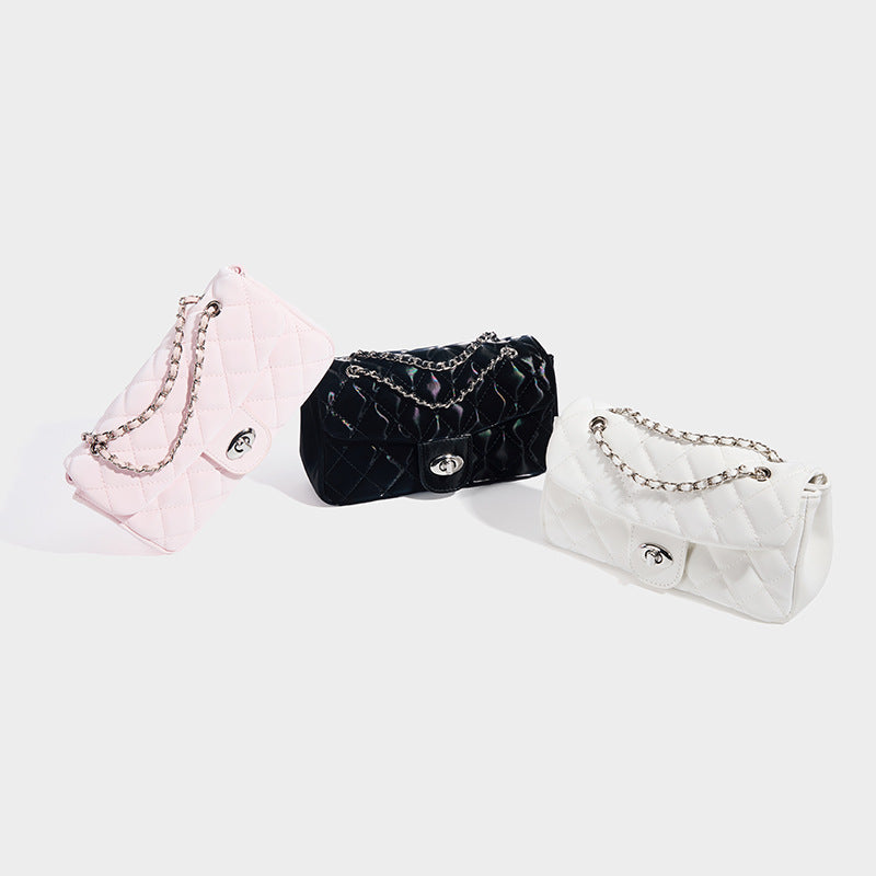 Compact diamond-quilted flap crossbody bag with silver-tone turn-lock and interwoven chain strap, detail view 2