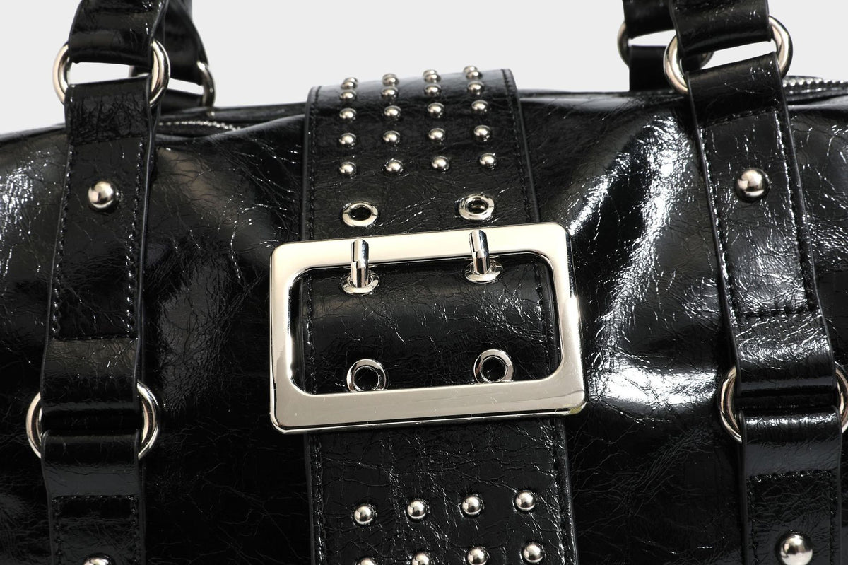 Glossy crinkled barrel handbag with silver stud buckle strap and detachable shoulder strap, detail view 29