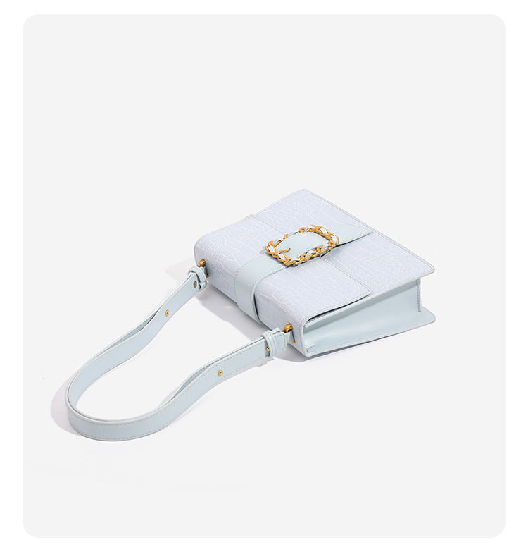Structured crocodile-embossed flap shoulder bag with gold chain buckle hardware and adjustable strap, detail view 12