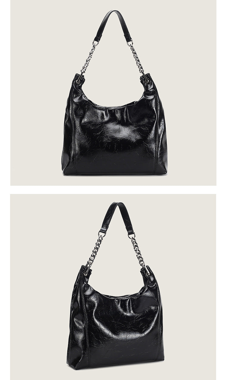 Glossy crinkled leather-look slouchy hobo bag with silver chain-and-leather shoulder strap and open top, detail view 12
