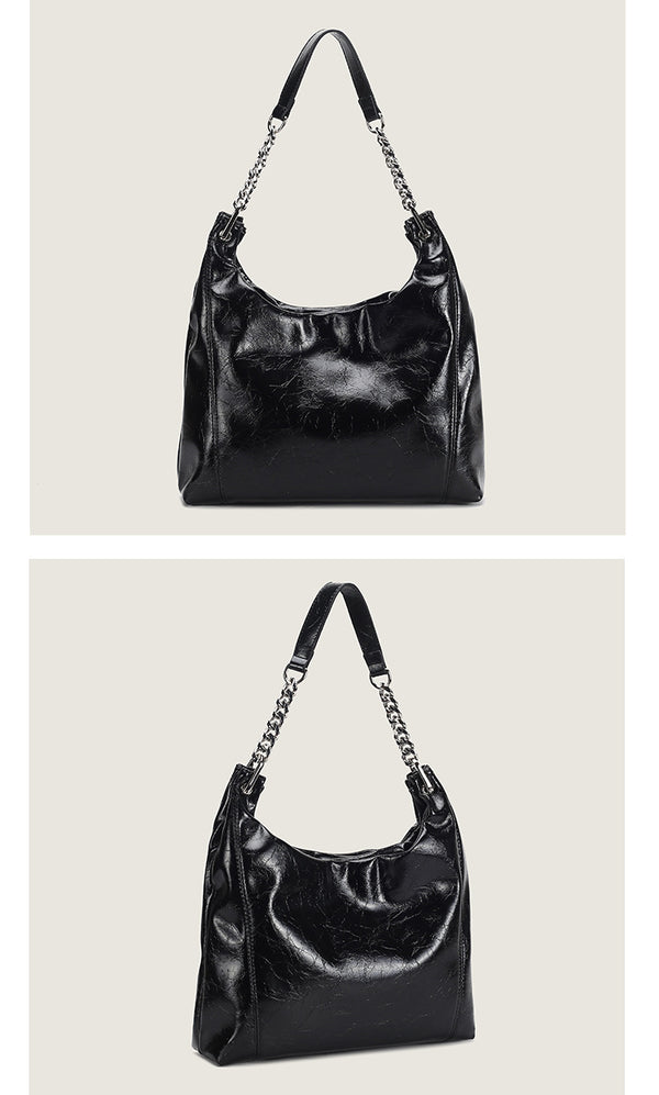 Glossy crinkled leather-look slouchy hobo bag with silver chain-and-leather shoulder strap and open top, detail view 12