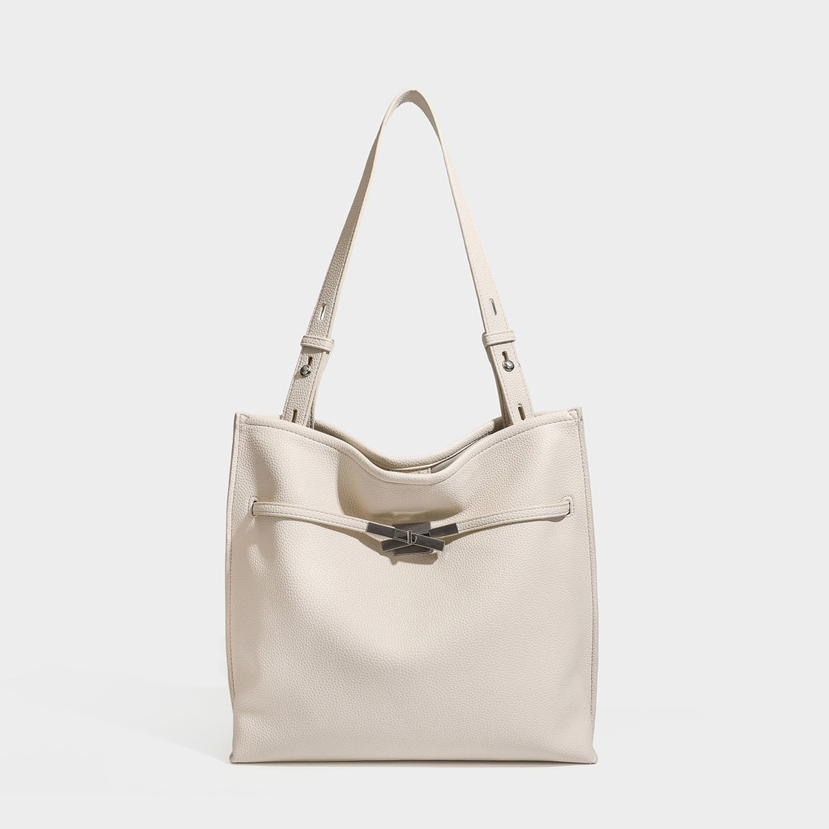 Large structured tote bag in pebbled leather-look finish with silver-tone twist-knot front detail and adjustable shoulder