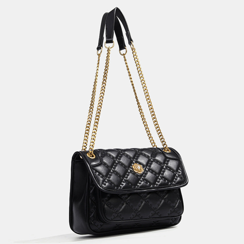 Compact diamond-quilted flap shoulder bag with gold-tone chain strap and floral turn-lock clasp, detail view 3