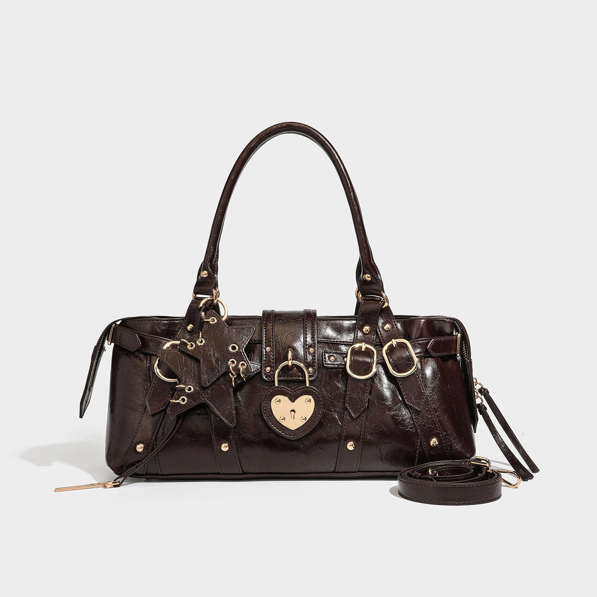 Dark brown glossy crinkled leather-look barrel bag with gold heart lock, dome studs, star charm, dual top handles and, detail