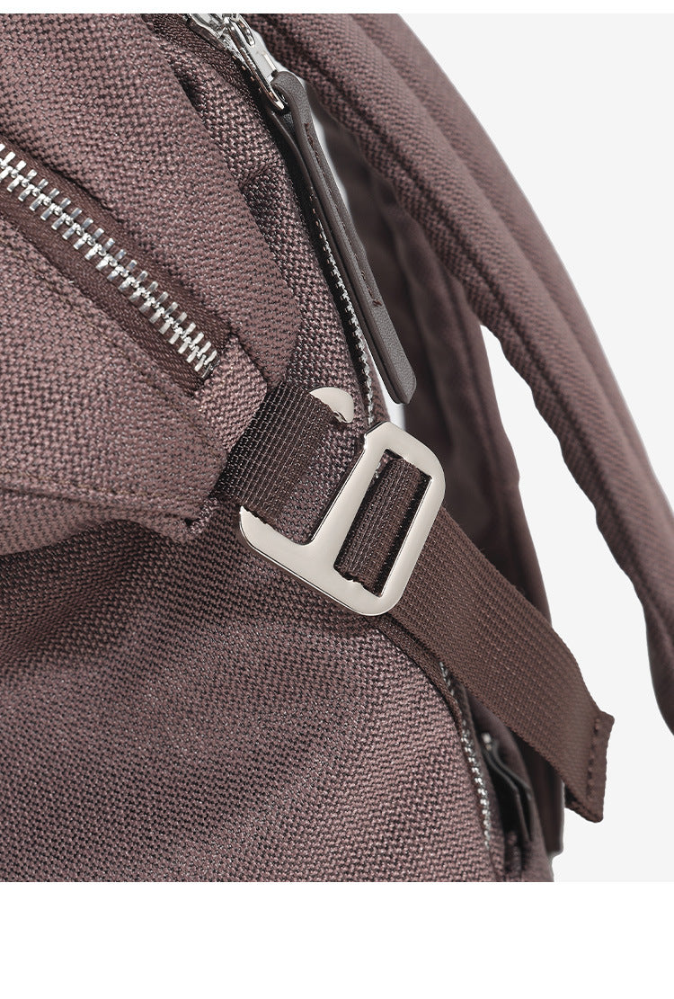 Structured matte-fabric backpack handbag with silver-tone zip closure and top carry handle, detail view 20