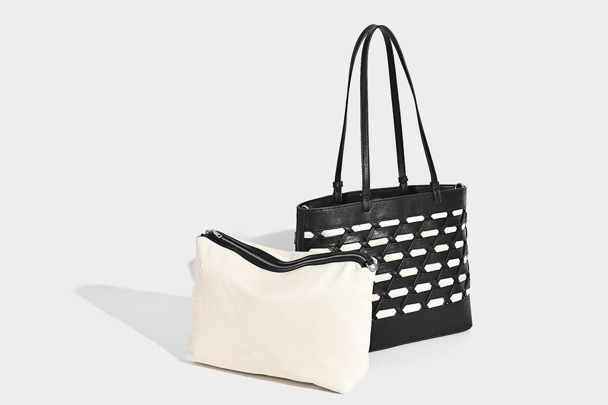 Structured woven lattice cutout tote bag with smooth leather-look trim, dual shoulder straps, and silver-tone hardware