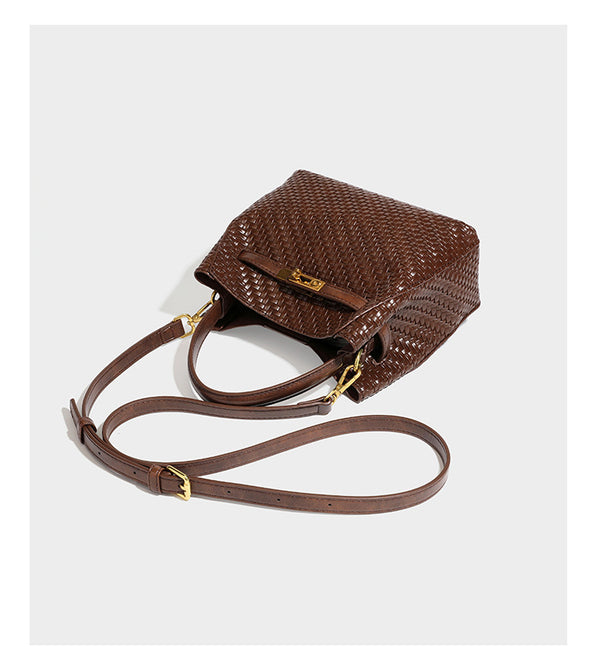Structured woven leather-look bucket bag with gold-tone turn-lock hardware and detachable shoulder strap, detail view 16