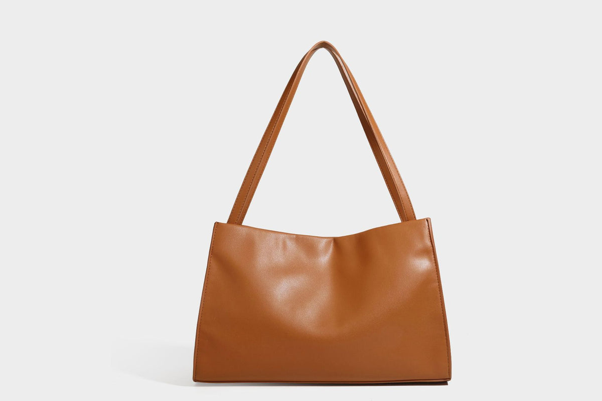 Structured rectangular shoulder tote bag with smooth leather-look finish, long double straps, and gold-tone gourd emblem on