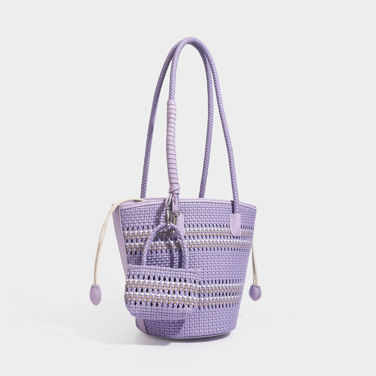 Light blue open-weave woven bucket tote bag with long braided shoulder straps, drawstring side ties, and attached mini pouch