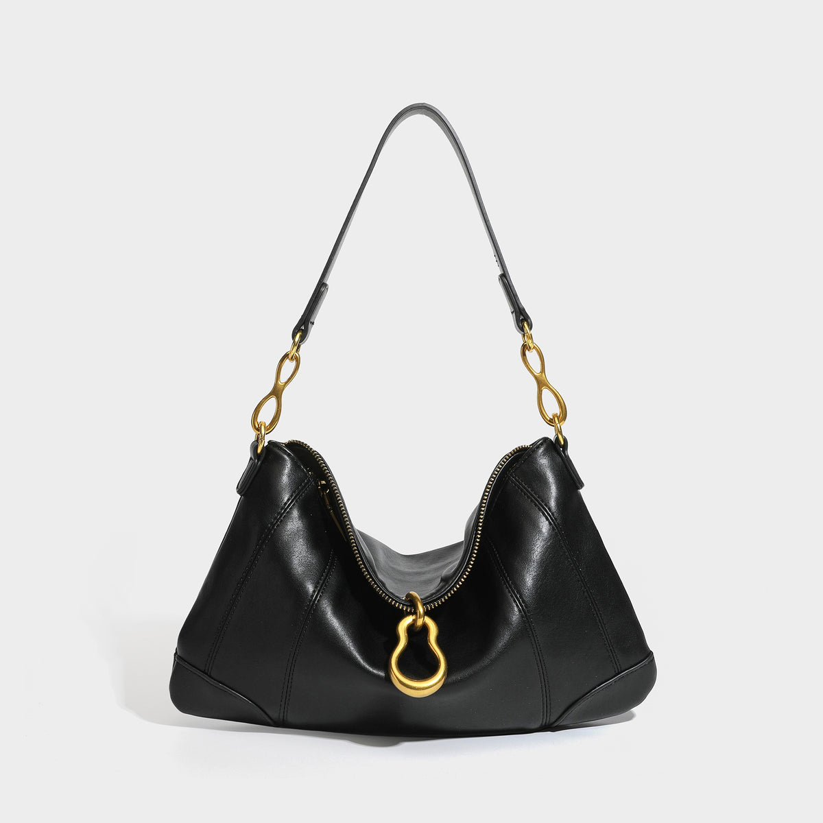 Slouchy denim shoulder bag with dark leather-look trim, gold-tone chain-link hardware, and top zipper closure, detail view 4