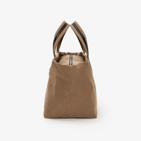 Large lightweight nylon tote bag with zipper closure, black leather-look handles, and trapezoid silhouette, detail view 18
