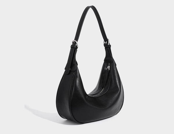 Crescent half-moon shoulder bag in pebbled leather-look finish with adjustable strap and silver-tone hardware, detail view 22