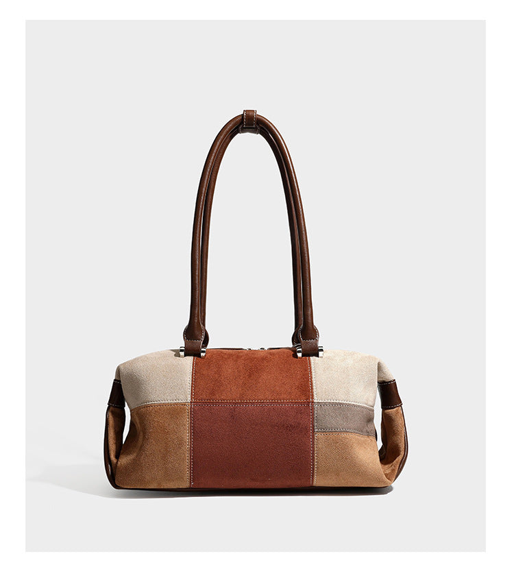 Patchwork suede-look barrel shoulder bag in brown, rust, tan, beige, and gray panels with double leather-look straps and