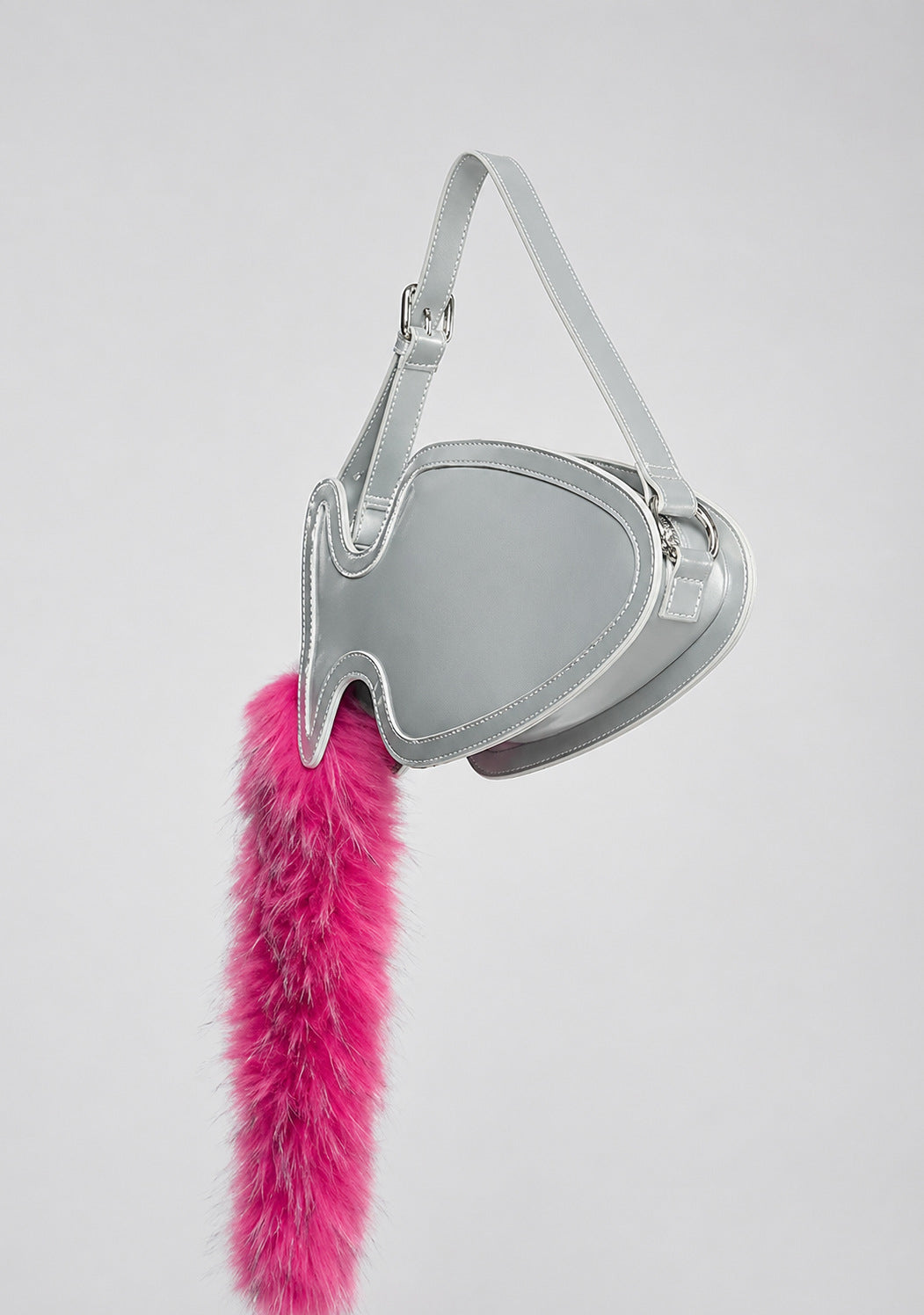 Fish-shaped pebbled leather-look crossbody bag with black faux-fur tail accent and adjustable shoulder strap, detail view 12