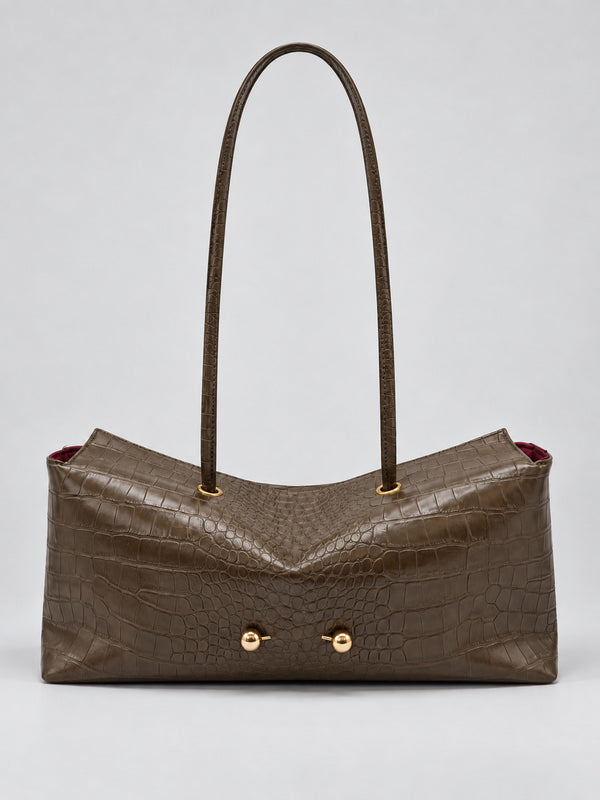 Wide embossed-texture shoulder tote bag with single loop handle and gold-tone toggle hardware, detail view 12