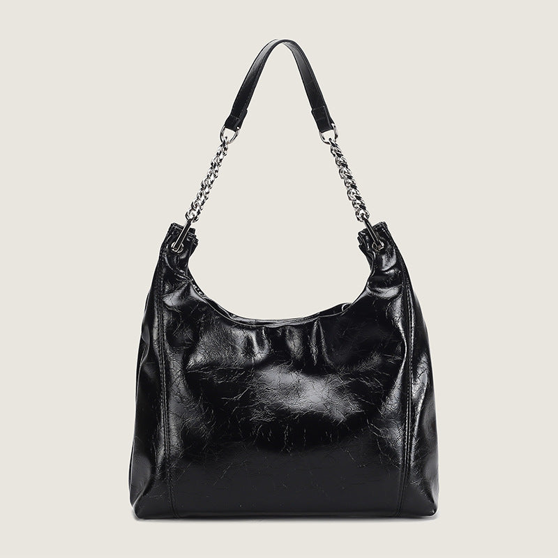 Glossy crinkled leather-look slouchy hobo bag with silver chain-and-leather shoulder strap and open top, detail view 8