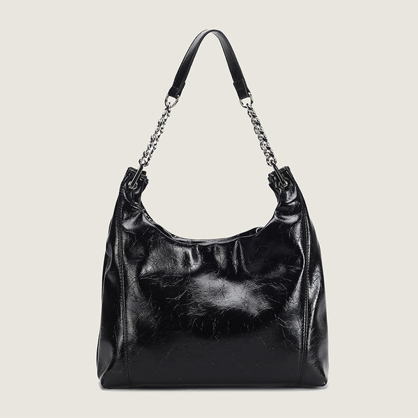 Glossy crinkled leather-look slouchy hobo bag with silver chain-and-leather shoulder strap and open top, detail view 8